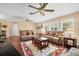 Bright living room with hardwood floors, comfortable seating, and plantation shutters creating a relaxing space at 5603 Ravenwood Dr, Sarasota, FL 34243