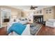 This bright living room features a fireplace, hardwood floors and comfortable seating at 5603 Ravenwood Dr, Sarasota, FL 34243