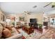 Spacious living room featuring hardwood floors, a cozy seating area, and natural light with an open layout at 5603 Ravenwood Dr, Sarasota, FL 34243