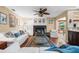 Inviting living room with fireplace, hardwood floors, and comfortable seating area at 5603 Ravenwood Dr, Sarasota, FL 34243