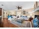 Cozy living room with hardwood floors, ceiling fan, and comfortable seating at 5603 Ravenwood Dr, Sarasota, FL 34243