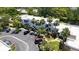 Aerial view showcasing the condo building, parking lot, and landscaping at 564 Lakeside Dr # 564, Bradenton, FL 34210