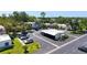 Exterior shot shows condo parking and multiple units amongst palm trees and well-kept lawns at 564 Lakeside Dr # 564, Bradenton, FL 34210