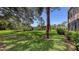 Well-maintained backyard with lush green lawn and serene pond views at 564 Lakeside Dr # 564, Bradenton, FL 34210