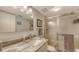 Well-lit bathroom featuring a marble countertop, a glass shower and neutral decor at 564 Lakeside Dr # 564, Bradenton, FL 34210