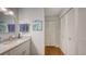 Clean bathroom featuring a modern vanity with a granite countertop and ample storage space with multiple closets at 564 Lakeside Dr # 564, Bradenton, FL 34210