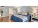 Bright bedroom with a comfortable bed, stylish linens, and a matching nightstand with a decorative lamp at 564 Lakeside Dr # 564, Bradenton, FL 34210