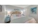 The bedroom showcases an inviting space with soft lighting, a cozy bed, and colorful artwork at 564 Lakeside Dr # 564, Bradenton, FL 34210