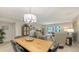 Dining area with modern light fixture is connected to the living room at 564 Lakeside Dr # 564, Bradenton, FL 34210