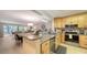 Updated kitchen with granite countertops, stainless steel appliances, and an open floor plan at 564 Lakeside Dr # 564, Bradenton, FL 34210