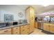 Bright kitchen with wood cabinets, granite countertops, and an open layout at 564 Lakeside Dr # 564, Bradenton, FL 34210
