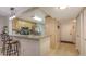 Bright kitchen featuring a counter bar, wood cabinets, and modern appliances at 564 Lakeside Dr # 564, Bradenton, FL 34210