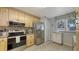 Well-equipped kitchen with granite countertops, stainless steel appliances, and ample natural light at 564 Lakeside Dr # 564, Bradenton, FL 34210