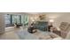 Inviting living room with comfortable seating, stylish decor, and sliding door access to the lanai at 564 Lakeside Dr # 564, Bradenton, FL 34210