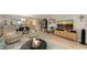 Open-concept living area features a dining space and entertainment setup at 564 Lakeside Dr # 564, Bradenton, FL 34210