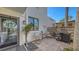 Cozy outdoor patio with brick pavers, seating, grill, and decorative fish art, perfect for relaxing at 564 Lakeside Dr # 564, Bradenton, FL 34210