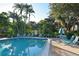 This inviting community pool offers a refreshing escape surrounded by lush tropical landscaping and seating at 564 Lakeside Dr # 564, Bradenton, FL 34210