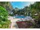 A lush community pool area surrounded by trees offers a tranquil and refreshing outdoor space at 564 Lakeside Dr # 564, Bradenton, FL 34210