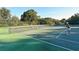 Community tennis courts where residents enjoy a friendly match surrounded by mature trees at 564 Lakeside Dr # 564, Bradenton, FL 34210