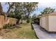 Spacious backyard featuring lush green grass and mature landscaping for privacy at 5902 22Nd Avenue E Dr, Palmetto, FL 34221