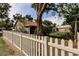 View of the backyard with a screened porch and a fenced yard, providing a secure outdoor space at 5902 22Nd Avenue E Dr, Palmetto, FL 34221