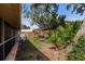 Beautiful backyard showcasing a wooden fence, mature trees, and a tranquil setting at 5902 22Nd Avenue E Dr, Palmetto, FL 34221