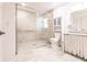Accessible bathroom featuring a step-free tile shower with glass doors and grab bars at 5902 22Nd Avenue E Dr, Palmetto, FL 34221
