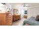 Comfortable bedroom featuring wood-look floors, natural light, and ample closet space at 5902 22Nd Avenue E Dr, Palmetto, FL 34221