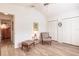 Bedroom with a vaulted ceiling featuring a ceiling fan, closet and an inviting sitting area at 5902 22Nd Avenue E Dr, Palmetto, FL 34221