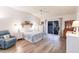 Serene bedroom with wood-look floors, ceiling fan, and sliding glass doors to the outside at 5902 22Nd Avenue E Dr, Palmetto, FL 34221