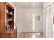 Bright entryway featuring wood-look tile flooring and a built-in display cabinet at 5902 22Nd Avenue E Dr, Palmetto, FL 34221