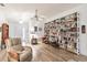 Inviting living room with wood-look flooring, a built-in bookcase, and comfortable seating at 5902 22Nd Avenue E Dr, Palmetto, FL 34221