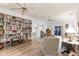 Spacious living room with ample natural light and wood-look tile flooring at 5902 22Nd Avenue E Dr, Palmetto, FL 34221