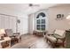 Bright living room with natural light, comfortable seating, and vaulted ceilings at 5902 22Nd Avenue E Dr, Palmetto, FL 34221