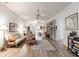 Bright and spacious living room featuring stylish furnishings, hardwood floors, and a decorative area rug at 5902 22Nd Avenue E Dr, Palmetto, FL 34221