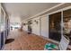 Large screened patio with tile flooring and comfortable seating for relaxing or entertaining at 5902 22Nd Avenue E Dr, Palmetto, FL 34221
