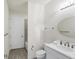A well-lit bathroom showcasing a single sink vanity and tile flooring at 5923 Snowy Egret Dr, Sarasota, FL 34238