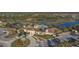 A bird's eye view of the community center, pools, tennis courts, and lush landscaping at 5923 Snowy Egret Dr, Sarasota, FL 34238