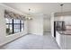 Dining area connects to kitchen, offers colorful window treatments, tile floor at 5923 Snowy Egret Dr, Sarasota, FL 34238