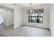Bright dining area with colorful window treatments and tile flooring at 5923 Snowy Egret Dr, Sarasota, FL 34238