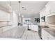Kitchen with island, stainless steel appliances, and white cabinets and counters at 5923 Snowy Egret Dr, Sarasota, FL 34238