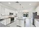 Well-lit kitchen features stainless appliances, granite counters and an island at 5923 Snowy Egret Dr, Sarasota, FL 34238