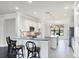 Bright kitchen featuring white cabinetry, granite countertops, and stainless steel appliances at 5923 Snowy Egret Dr, Sarasota, FL 34238