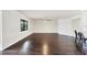Spacious living room with hardwood floors, crown molding, and a ceiling fan at 5923 Snowy Egret Dr, Sarasota, FL 34238