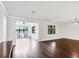 Spacious living room featuring hardwood floors and lots of natural light at 5923 Snowy Egret Dr, Sarasota, FL 34238