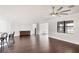 Spacious living room with hardwood floors and large windows at 5923 Snowy Egret Dr, Sarasota, FL 34238