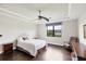 Spacious main bedroom with a tray ceiling, a large window and hardwood floors at 5923 Snowy Egret Dr, Sarasota, FL 34238