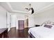 Bright main bedroom boasts hardwood floors, ceiling fan, and en-suite bathroom access at 5923 Snowy Egret Dr, Sarasota, FL 34238
