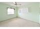 A tidy bedroom showcases neutral carpet, bright light and a ceiling fan at 5951 Todd St # D37, Bradenton, FL 34207