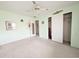 Another view of the mint bedroom with closets, artwork and carpeting at 5951 Todd St # D37, Bradenton, FL 34207